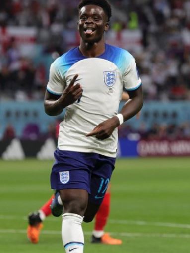 Yomi Saka son Bukayo Saka celebrating after scoring in FIFA World Cup 2022